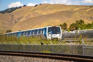 BART train through rolling hills